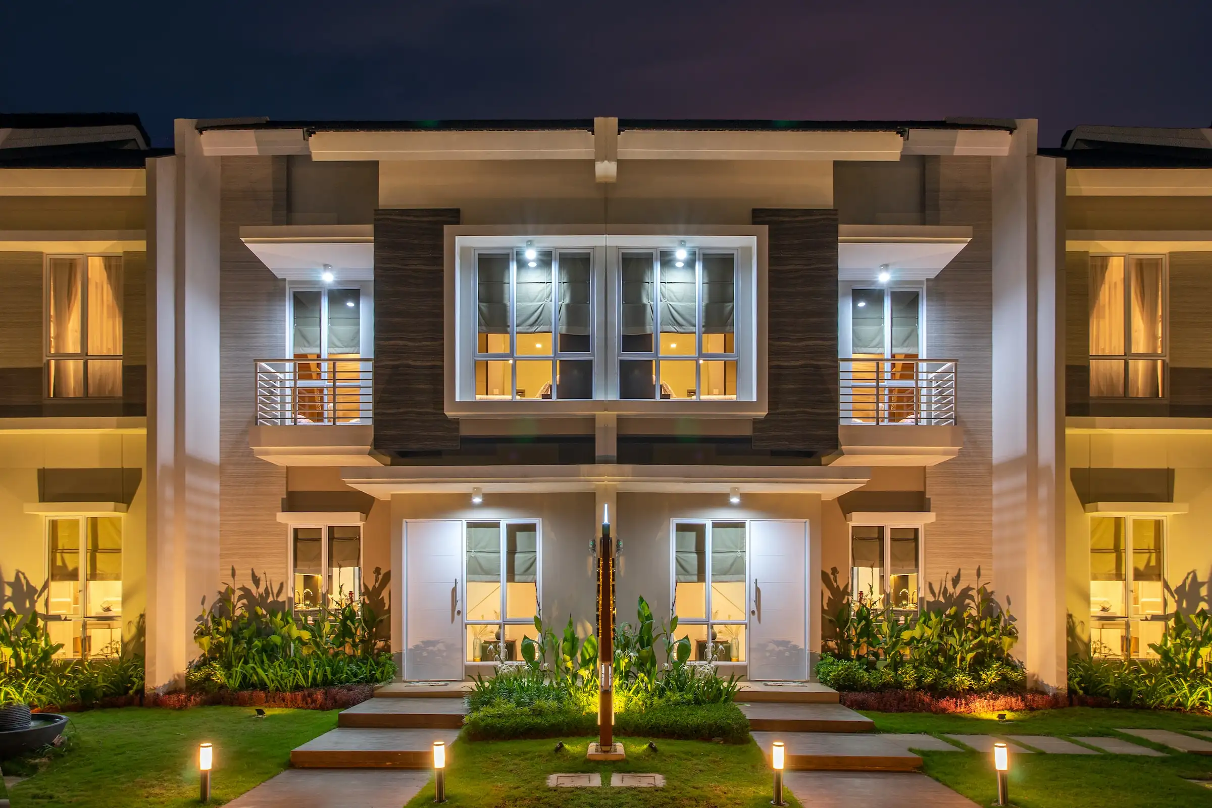 Two-storey home lit up at night