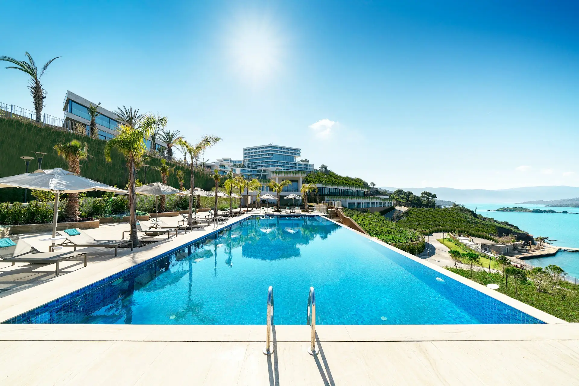 Clear blue swimming pool with a sun deck